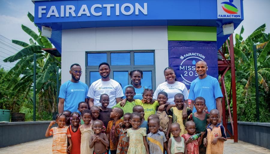 Children and the FairAction team celebrating Children's Day at the Aba Apapa Smart Water Kiosk