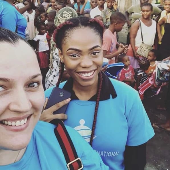 Fairaction volunteers with the community they serve