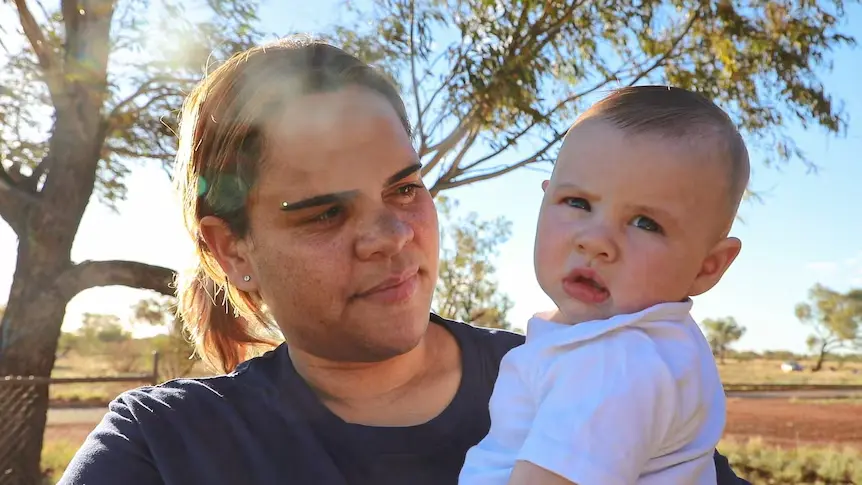 Warburton mother Angelica McLean holding her baby daughter